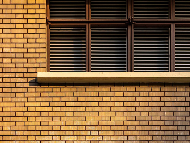 The reddish brown tiles of exterior wall